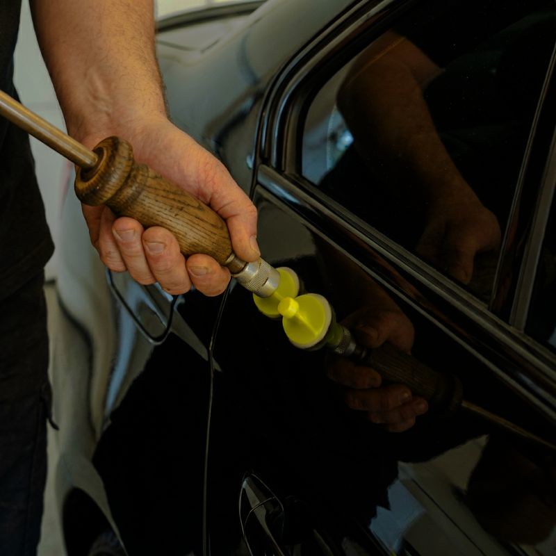 Auto Body technician doing paintless dent repair-Sherrill Paint & Body paintless dent repair Auto Body technician doing paintless dent repair-Sherrill Paint & Body paintless dent repair